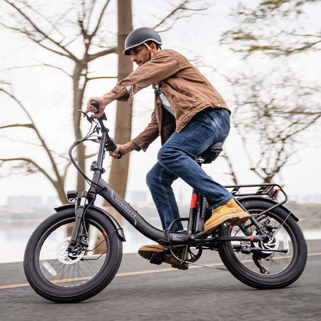 Adult male riding an affordable foldable electric ebike