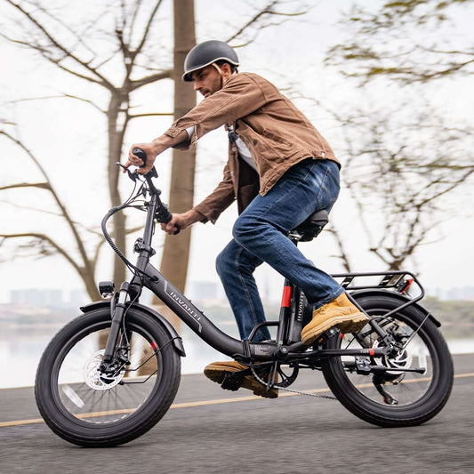 Adult male riding an affordable foldable electric ebike