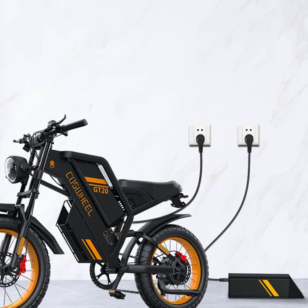Black Coswheel GT20 1000W 48V adventure ebike with 20 inch fat tires and orange accents. charging